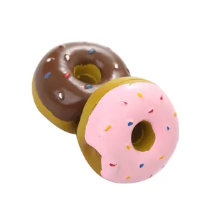 Pair of colorful latex squeaky donut toys for dogs, ideal for teething and play.