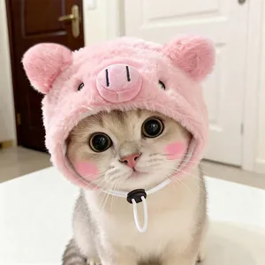 Detailed close-up view of a cute pink plush pig-themed decorative hat for pet cats
