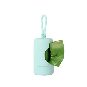 Detail of a portable mint green pet waste bag dispenser with a matching carabiner