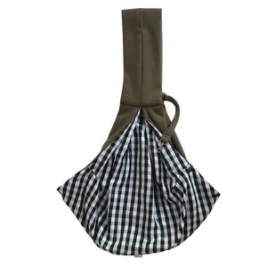 Detail view of olive green pet sling carrier with black and white checkered lining