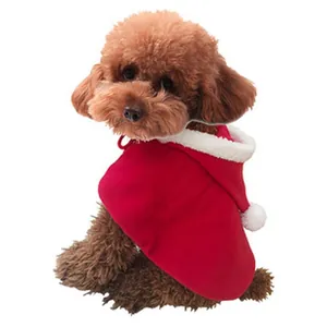 Adorable red Christmas hooded pet cape with white faux fur trim modeled by a brown poodle.