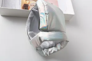 Detailed close-up of metallic silver pet astronaut costume hood with iridescent finish