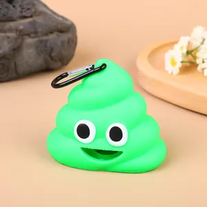Detailed close-up of a green poop-shaped dog waste bag dispenser with metal carabiner