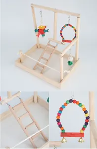 Detailed view of a wooden parrot playground stand with colorful bird toys and a ladder.