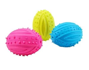 Detailed view of three colorful spiky rugby squeaky toys for dogs in pink, yellow, blue
