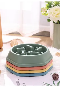 Stack of colorful slow feeder pet bowls for dogs and cats with anti-gulping internal design