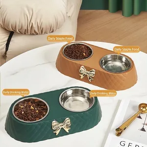 Light luxury double pet bowl with stainless steel inserts and elegant bow decoration