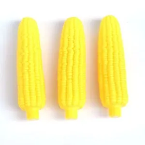 Set of three bright yellow squeaky corn toys for puppy teething and dental cleaning
