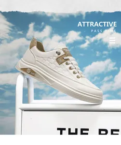 Side view of white men's sneakers with embossed texture and tan leather accents.