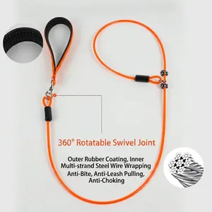 Close-up of orange dog leash showing steel wire core and 360-degree rotating handle