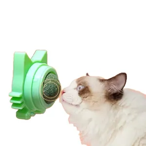 Wall-mounted catnip ball toy for cats to lick and play with, featuring a green cat-shaped base