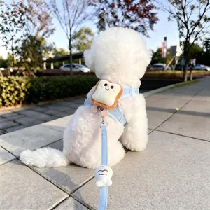 Detail view of cute plush toast decoration on blue vest dog harness