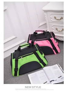 Detailed view of breathable mesh pet carrier bags in pink and lime green colors