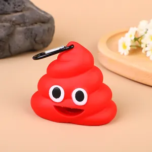 Detailed view of red poop emoji shaped dog waste bag dispenser with carabiner