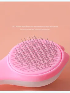 Detail of 150-degree angled stainless steel needles on a pink pet grooming brush