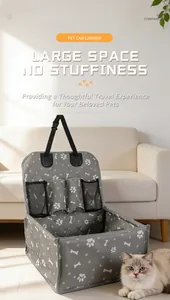 Grey foldable pet car carrier with mesh pockets and cute paw prints in a home setting