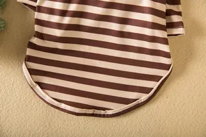Close-up of brown striped dog shirt hem showing the high-quality stitching detail