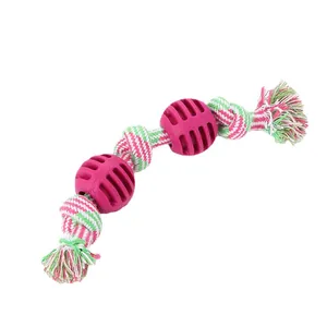 Durable braided cotton rope dog toy featuring two grooved TPR rubber balls for chewing.