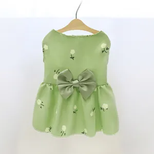 Elegant green princess style pet dress with white floral pattern and a large decorative bow