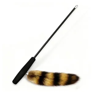 Detailed view showing the telescopic rod mechanism and striped faux fur tail attachment