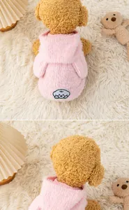 Close-up detail of soft pink fuzzy pet hoodie for small dogs showing hood and texture