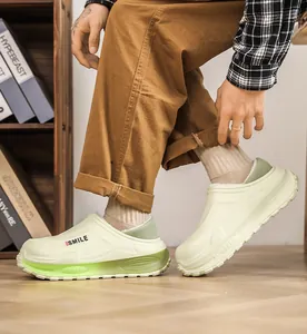 Side view of lime green fleece-lined winter clogs worn indoors for warm comfort.