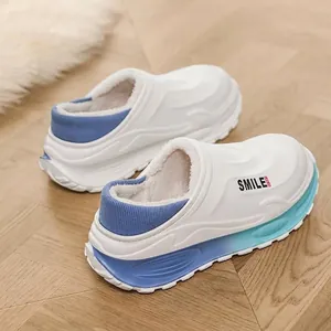 Comfortable white fleece-lined winter clogs featuring a stylish blue gradient sole