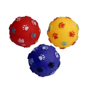 Group of three colorful squeaky pet toy balls with embossed paw print patterns