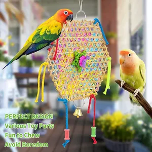 Detail view of colorful hanging parrot toy featuring bamboo weaving and shredded paper