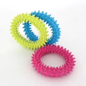 Detailed view of three durable TPR spiked chew rings for puppy teething and care