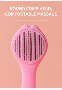 Close-up of pink self-cleaning pet brush with rounded stainless steel bristles