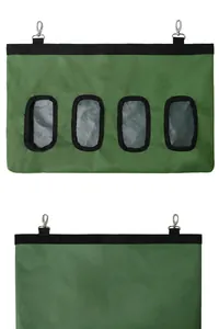 Detailed view of green hanging hay feeder bag with four feeding holes for small pets