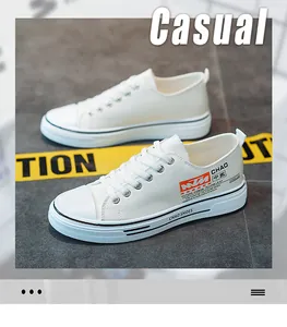Fashionable white low-top canvas sneakers for men featuring a casual street style design