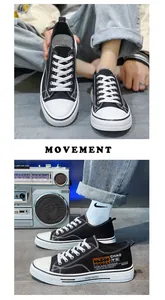 Detailed view of trendy black low-top canvas sneakers for men with unique side patches