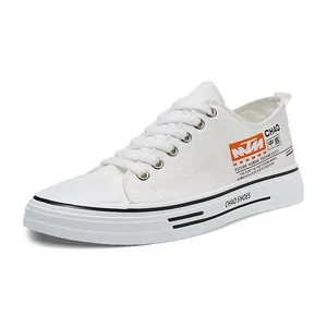 Professional stylish white low-top canvas sneakers for men with trendy lace-up design
