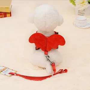 Rear view of red plush angel wing harness and leash set on white dog model