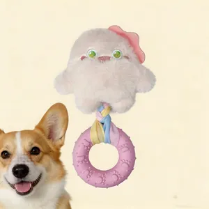 Detail view of the plush monster dog squeaky toy with braided rope and rubber donut ring