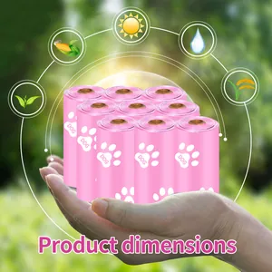 Close-up detail of nine rolls of pink biodegradable dog poop bags held within a palm
