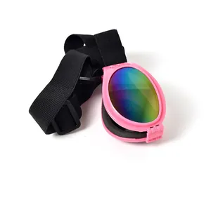 Detail of foldable pink pet sunglasses featuring rainbow lenses and an adjustable strap.
