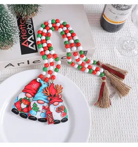 Close-up of Christmas gnome wooden bead garland with red, white, and green beads