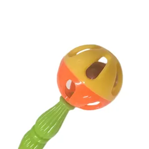 Close-up of a colorful plastic bird rattle toy for parrot beak and claw exercise