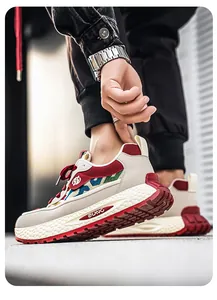 Detail of men's ethnic patchwork sneakers with textured thick midsole and red outsole