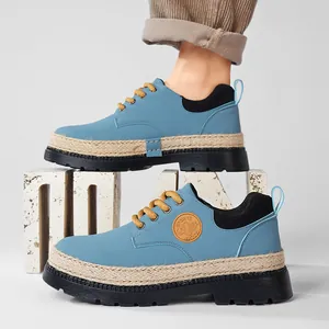 Stivaletti Martin blu con zeppa e bordo in corda intrecciata e lacci