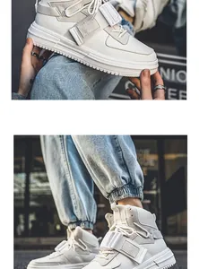 Sneakers alte bianche con cinturini a fibbia decorativi e un design elegante in stile street