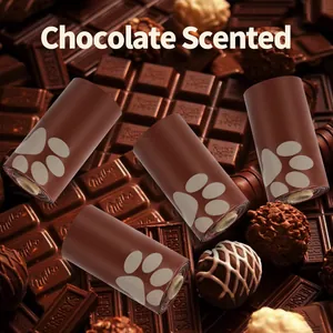 Detail of chocolate scented brown pet poop bags with paw prints on chocolate background