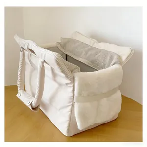 Detailed view of cream-colored quilted pet carrier with soft plush lining and mesh windows