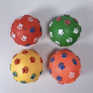 Set of four colorful vinyl pet squeaky balls with embossed paw print design