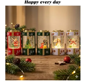 Set of five decorative Christmas snow globe lanterns with glowing LED light and swirling snow.