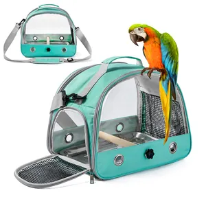 Teal portable bird carrier with transparent window and shoulder strap for small pets