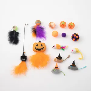 Set of Halloween-themed cat toys including plush pumpkins and mice with feathers.